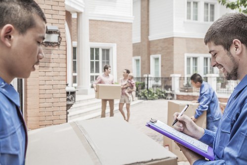 Furniture pick-up team collecting bulky home furniture in Queenspark