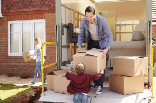 Professional movers handling a piano removal in Queenspark