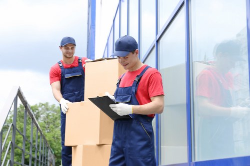 Professional loading of furniture into a Queenspark removal van