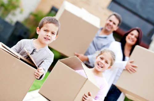 A Queenspark moving team sorting household items for charity and recycling streams