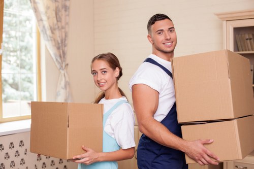 Professional man with van helping with a small home move in Queenspark