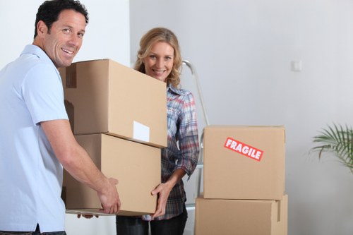 Professional Queenspark movers packing household items carefully